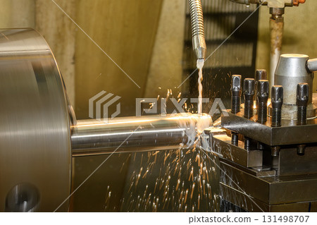The lathe machine finish cut metal shaft parts with liquid coolant method. The lathe machine finish cut metal shaft parts with liquid coolant method. 131498707