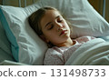 Young girl is laying in hospital bed 131498733