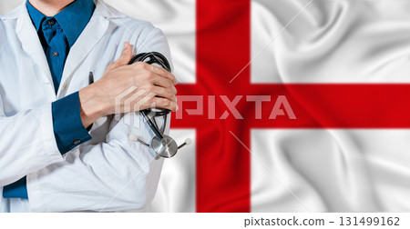 England healthcare concept. Doctor with stethoscope on England flag. Doctor holding stethoscope on English flag England healthcare concept. Doctor with stethoscope on England flag. Doctor holding stethoscope on English flag 131499162