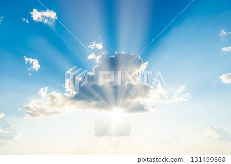 Sun light through cloud on blue sky Sun light through cloud on blue sky 131499868
