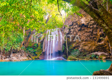 Tropical waterfall with emerald lake in jungle forest Tropical waterfall with emerald lake in jungle forest 131499891