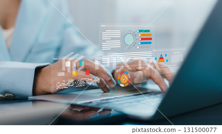 Businesswoman using laptop with data analytics dashboard and digital business report visualization Businesswoman using laptop with data analytics dashboard and digital business report visualization 131500077