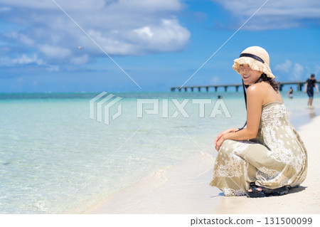 Emerald beach and young woman Emerald beach and young woman 131500099