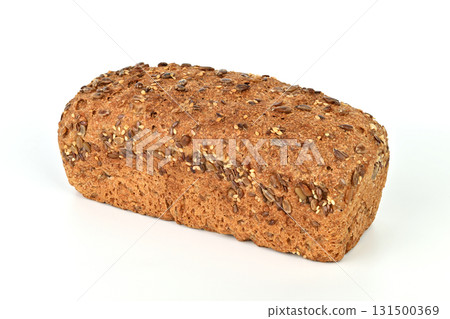 A loaf of bread with nuts on top A loaf of bread with nuts on top 131500369