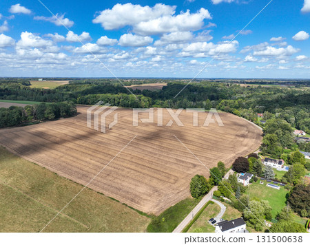 Aerial view of farmland surrounded by forest in the Belgian province of Walloon Brabant. 131500638