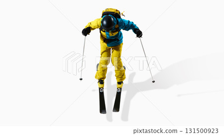 Male skier in blue and yellow uniform jumping with poles isolated on white background 131500923