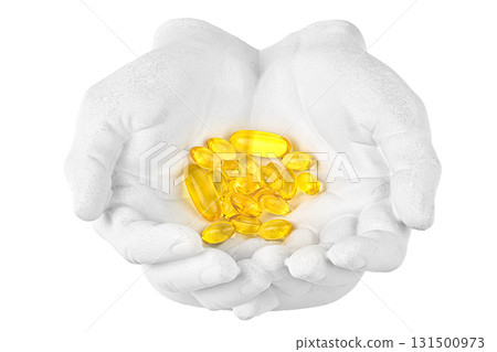 A hand holding a bunch of yellow pills 131500973