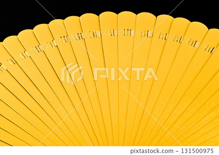 A yellow object with a lot of numbers on it 131500975