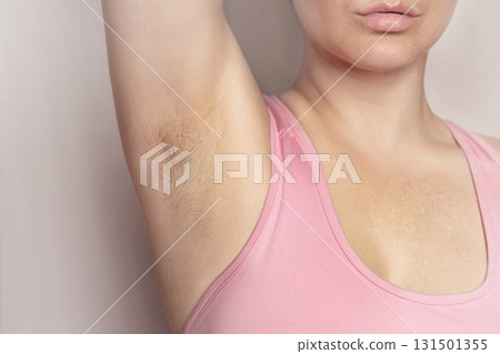 Armpit hair of caucasian women. Woman showing natural body hair without shaving. Hairy woman. Close up 131501355