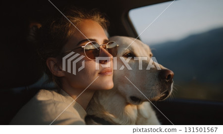 Woman Wearing Sunglasses With Dog In Car During Sunset. Peaceful Road Trip Moment With Pet 131501567