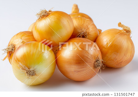 Fresh orange onions piled together on a white background ready for cooking 131501747