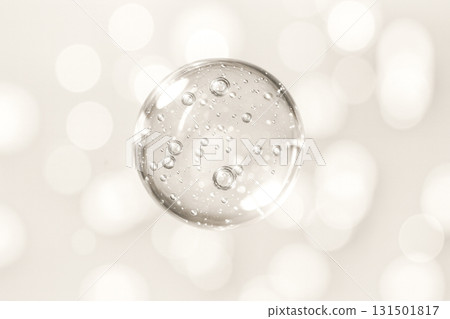 Image of transparent beauty ingredient bubbles floating on a beige background 131501817