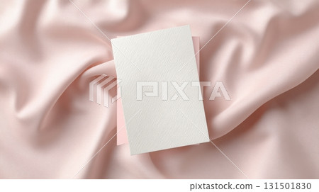 Blank White Card On Soft Pink Silk Fabric Background. Elegant Invitation Or Greeting Card Concept 131501830