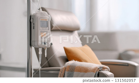 Iv Infusion Pump And Comfortable Chair In Medical Setting. Healthcare Environment For Patient Treatment Iv Infusion Pump And Comfortable Chair In Medical Setting. Healthcare Environment For Patient Treatment 131502057