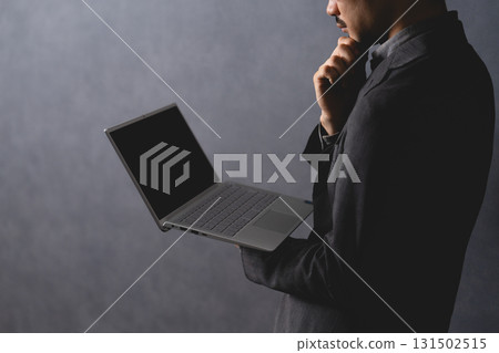 A man who operates a laptop computer 131502515