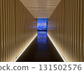 A long, illuminated, dreamy corridor reminiscent of a luxury hotel 131502576