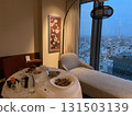 Hotel room service meal: A room with a sofa and a view of Tokyo Skytree from the window 131503139