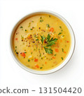 A bowl of vegetable soup with fresh herbs, isolated on a white background 131504420