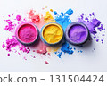 Three jars with colorful Holi powder on white background 131504424