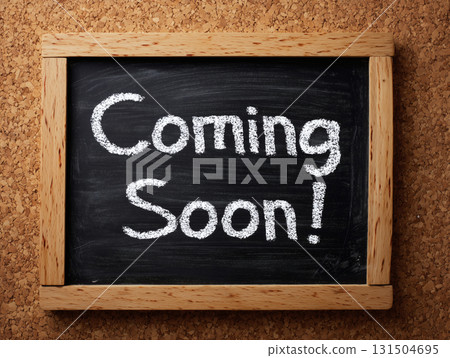 "Coming Soon" written in chalk on a blackboard 131504695