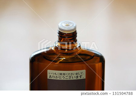 Hair growth product with the screw cap at the top of the bottle opened Hair growth product with the screw cap at the top of the bottle opened 131504788