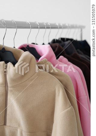 Fleece sweaters on hangers. Fashion, online stores, seasonal clothing collections. 131505079