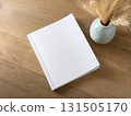 Books and a white book on the desk 131505170