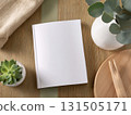 Books and a white book on the desk 131505171