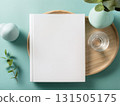 Books and a white book on the desk 131505175