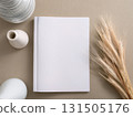 Books and a white book on the desk 131505176