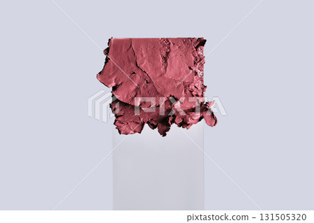 The texture of red lipstick on glass on a neutral background. 131505320