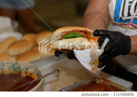 Freshly Prepared Sandwich With filled meatballs with tomato sauce served at Festival Freshly Prepared Sandwich With filled meatballs with tomato sauce served at Festival 131506809