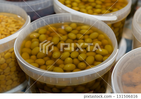 Green olives in brine in the italian market Green olives in brine in the italian market 131506816