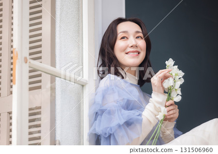A woman with a bouquet 131506960