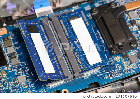 Two new RAM memory chips in the motherboard of a modern laptop. Upgrading personal computer 131507680