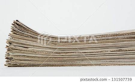 Stack of daily newspapers on a table. Pile of business papers on white background Stack of daily newspapers on a table. Pile of business papers on white background 131507739