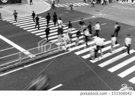 People crossing the crosswalk at an intersection in the busy Umeda district of Osaka People crossing the crosswalk at an intersection in the busy Umeda district of Osaka 131508042