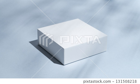 White square boxes on a blue background with shadows close up. 131508218