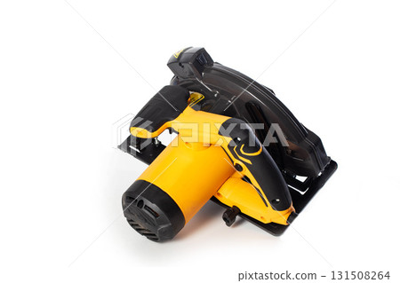 A powerful electric hand-held circular saw isolated on a white background, close-up. Woodworking tool. 131508264