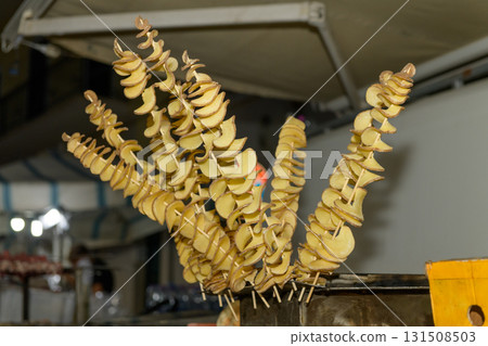 Spiral potato skewers Ready to Cook at Street Market Spiral potato skewers Ready to Cook at Street Market 131508503