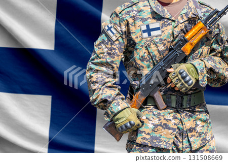 Finland flag with soldier holding assault rifle Finland flag with soldier holding assault rifle 131508669