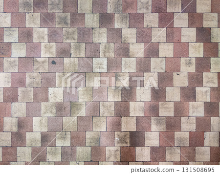 Worn checkerboard soviet tile floor in factory locker room 131508695