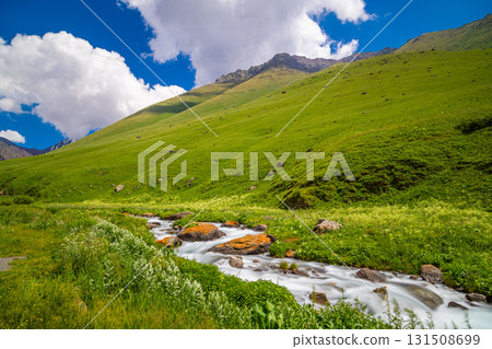 Serene landscape with mountains and river in tranquil nature in Kyrgyzstan Serene landscape with mountains and river in tranquil nature in Kyrgyzstan 131508699