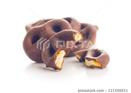 Chocolate covered pretzels isolated on white background. Chocolate covered pretzels isolated on white background. 131508831