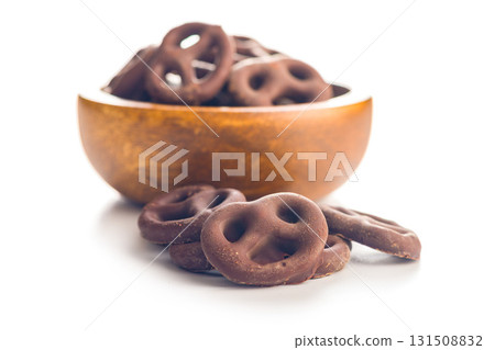 Chocolate covered pretzels isolated on white background. Chocolate covered pretzels isolated on white background. 131508832