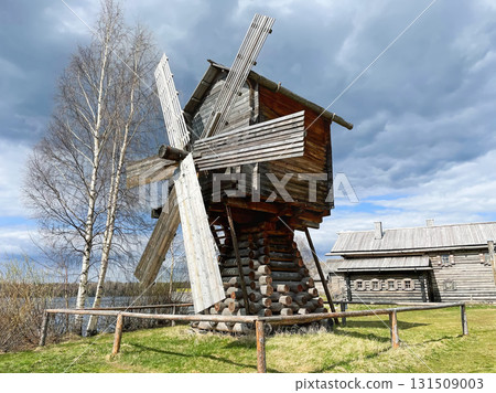 Ancient Wooden Mill near Birch Trees under Cloudy Sky 131509003