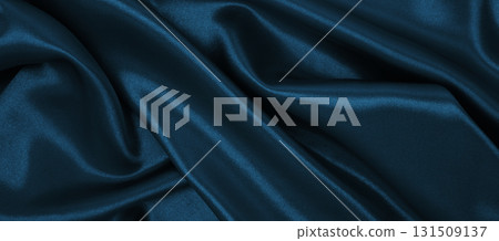 Smooth elegant blue silk or satin luxury cloth texture as abstract background. Luxurious Christmas background or New Year background design 131509137