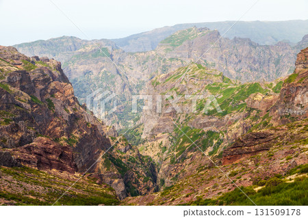 A dramatic canyon carved by steep cliffs and layered rock. Landscape of Madeira A dramatic canyon carved by steep cliffs and layered rock. Landscape of Madeira 131509178