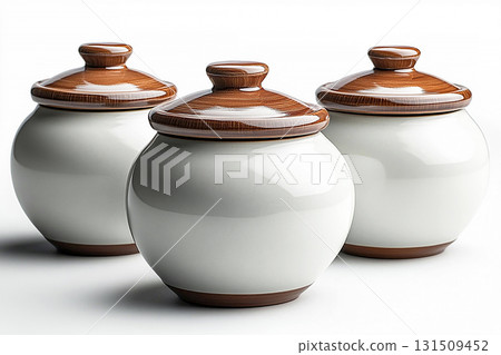Home aesthetic. Light brown. Ceramic containers with lid for storing groceries in a rustic style on a white background. Home aesthetic. Light brown. Ceramic containers with lid for storing groceries in a rustic style on a white background. 131509452