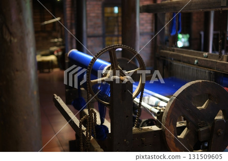 Separate silk worm via spinning wheel, Thai wisdom. process highlights sustainable textile making, natural materials, and the dedication in rural workshops. 131509605